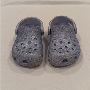Sparkly blue and purple toddler crocs